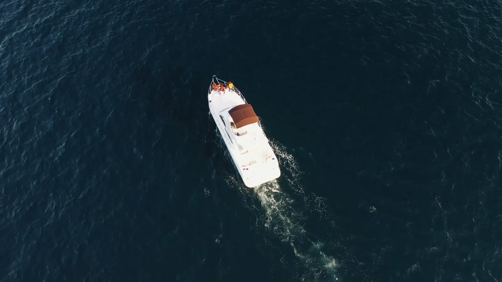 A yacht cruising through deep blue water